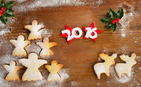 Christmas tree of homemade angel cookies on a wooden table. 2016 New year. Top view