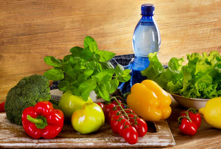 Fresh organic vegetables with bottle of waterの写真素材