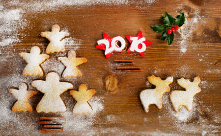 Christmas tree of homemade angel cookies on a wooden background. 2016 New year. Top viewの写真素材