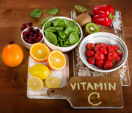 Food containing vitamin A on wooden table.の写真素材