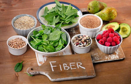 Foods rich in Fiber on a wooden table. Healthy eating. Selective focusの写真素材
