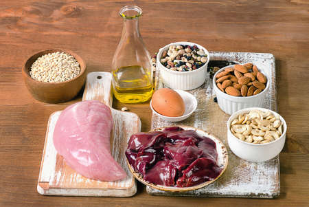 Foods with Selenium  on rustic wooden board.の写真素材