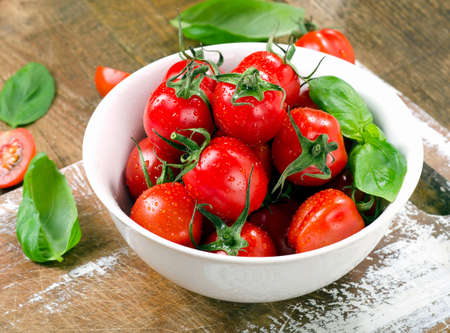 Fresh tomatoes on  wooden table. Selective focusの写真素材