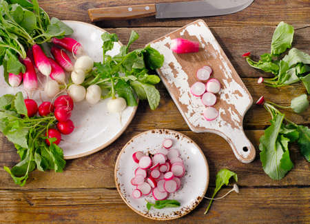 Bundle of fresh organic radishes on table. Top viewの写真素材