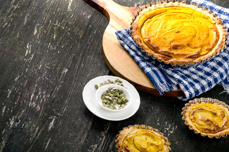 Homemade Pumpkin Pie for Thanksgiving  on a rustic table.の写真素材