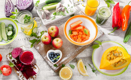 Different fruits, juices and vegetables. Healthy diet detox food. Top viewの写真素材