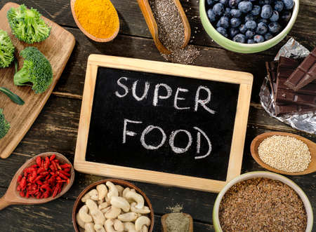 Super foods on  wooden background. Top viewの写真素材