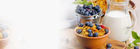 Healthy breakfast - Corn flakes with fresh blueberries and milk. Selective focus