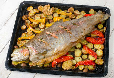 Whole salmon with vegetables. Top viewの写真素材