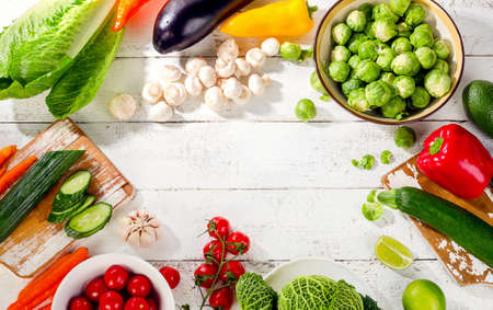 Raw organic vegetables  on a wooden background. Top view. Diet food concept.の写真素材