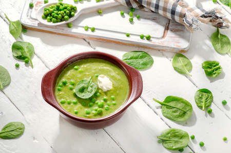 Green Pea Soup with Cream and spinach. Top viewの写真素材