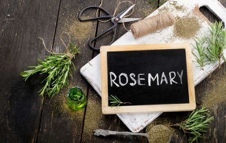 Rosemary  on a rustic wooden background. Flat layの写真素材