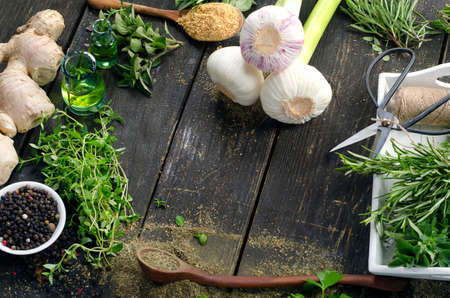 Herbs and spices on a wooden background. Top viewの写真素材