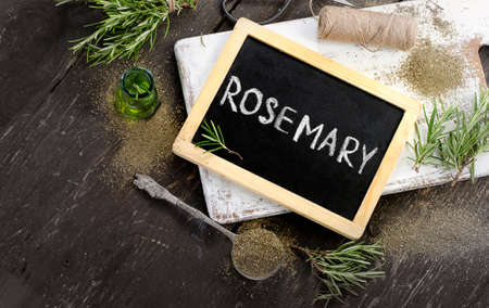 Rosemary  on a rustic wooden background. Flat layの写真素材
