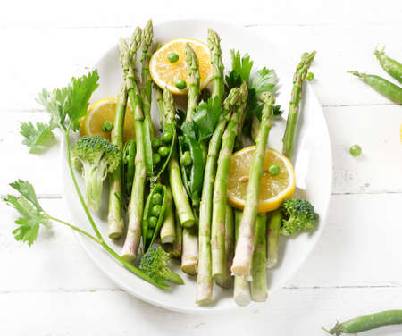 Green asparagus on a white plate.の写真素材