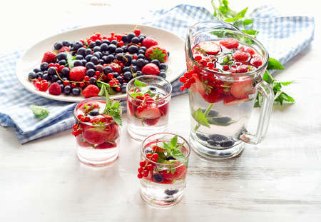 Infused water with fresh berries.の写真素材