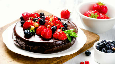 Chocolate cake with fresh different berriesの写真素材