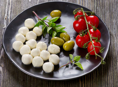 Mozzarella, cherry tomatoes and fresh basil.