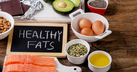 Selection of healthy fat sources on wooden background. Top viewの写真素材