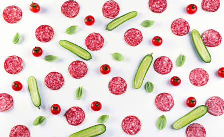 Background of Salami slices and fresh vegetables. Top viewの写真素材