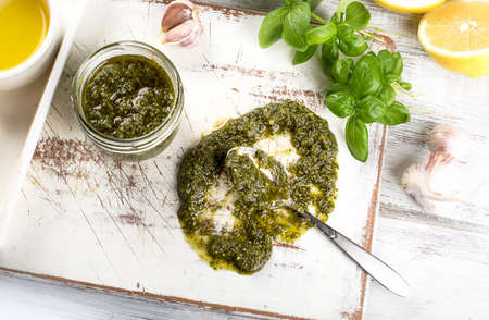Homemade pesto sauce and ingredients on white wwjden  backgroundの写真素材