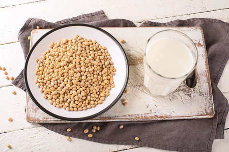 Soy milk and soybean on wooden table.の写真素材