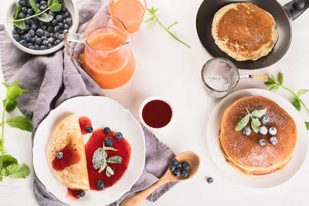 Healthy breakfast with coffee, pancakes, fresh berries and juice. Top view.の写真素材
