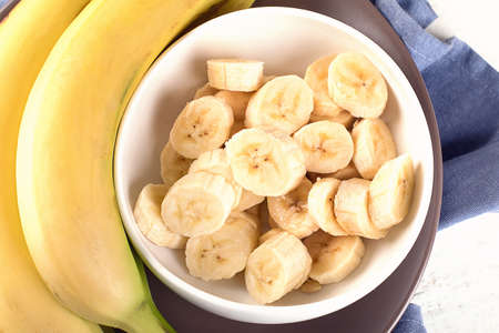 Fresh bananas on white wooden background. View from aboveの写真素材