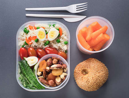 Healthy lunch boxes and bottle of waterの写真素材