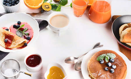 Healthy breakfast with coffee, pancakes, fresh berries and juice. Top view.