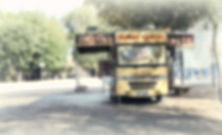 Abstract blurred background of food trucks.