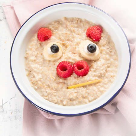 Cute pig face shaped oatmeal for kids breakfastの写真素材