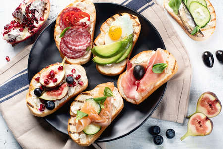 Small sandwiches set. Italian brushetta or spanish tapas の写真素材