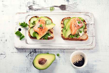 Toast with avocado, cucumber and  salmon. Healthy  eatingの写真素材