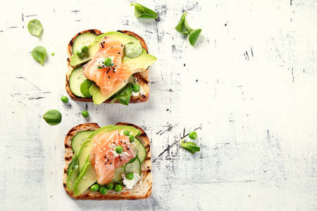 Toast with avocado, cucumber and  salmon. Healthy  eatingの写真素材