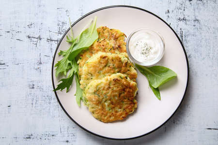 Zucchini fritters. Vegetable vegetarian zucchini pancakesの写真素材