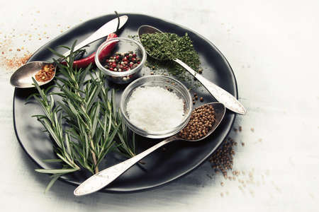 Fresh rosemary, vegetables and spices. Healthy cooking concept. Top viewの写真素材