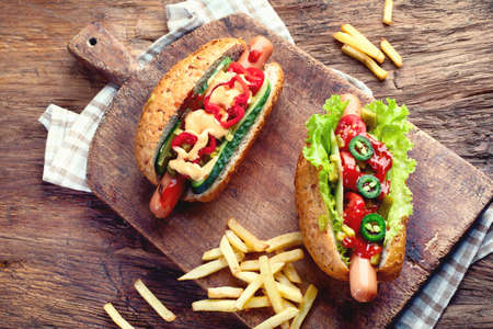 Delicious homemade hot dogs with sausages and fresh vegetablesの写真素材