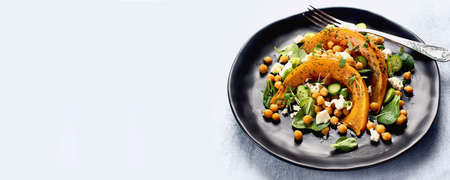 Roasted pumpkin salad with feta and chickpea. Panoramaの写真素材