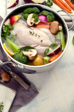 Chicken soup with vegetables. Ready for cooking. Healthy diet eating conceptの写真素材