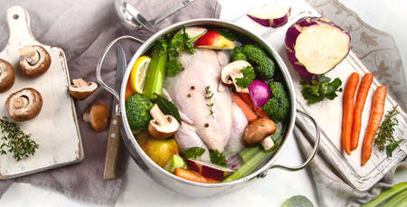 Chicken soup with vegetables. Ready for cooking. Healthy diet eating conceptの写真素材