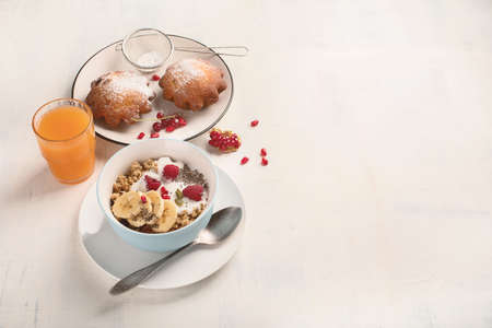 Bowl of granola with yogurt and fresh berries for healthy breakfast. Top view with copy spaceの写真素材