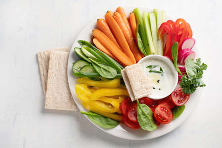 Healthy snacks. Fresh vegetables with sauce. Top viewの写真素材