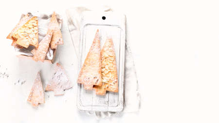 Christmas cookies shaped as  Christmas tree. Top view with copy spaceの写真素材