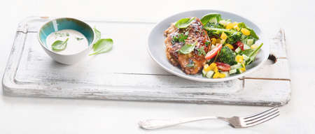 Chicken breast with fresh vegetable salad. Healthy diet menu.の写真素材