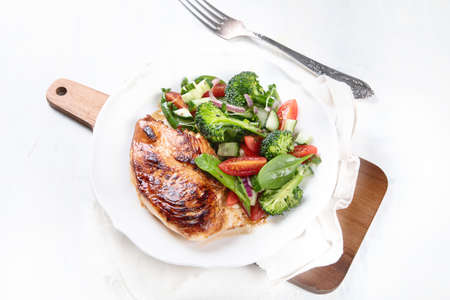 Chicken breast with fresh vegetable salad. Healthy diet menu. Top view, flat lay