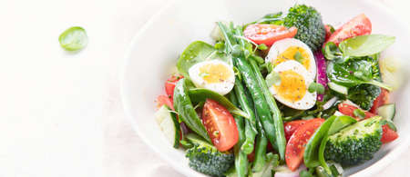 Vegetables  salad with eggs, green beans, broccoli and tomatoes. Diet menu. Healthy eating. Panorama, bannerの写真素材
