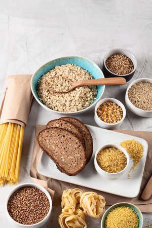 Different types of cereals and grains. High dietary fiber foods. Top view with copy spaceの写真素材