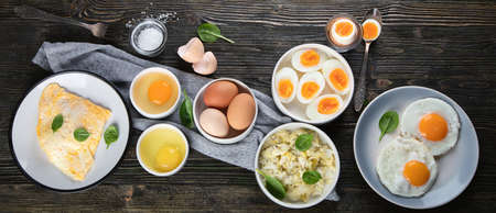 Different Ways to Cook Eggs on dark wooden background. Top view.