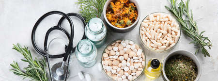 Alternative medicine herbs and homeopathic globules. Homeopathy medicine concept. Panorama, bannerの写真素材